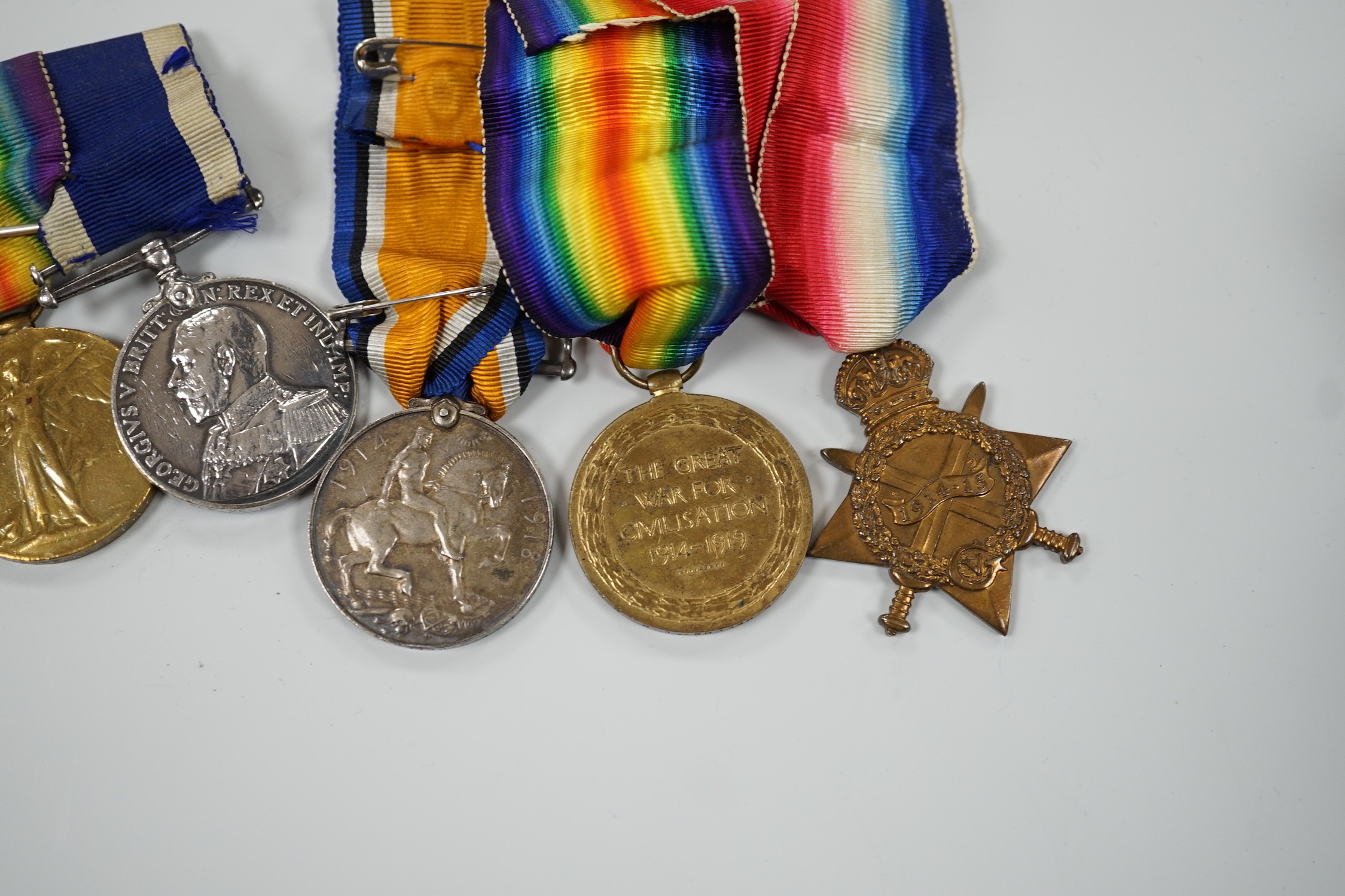 A WWI naval medal group of four with portrait photo with records and one other WWI trio